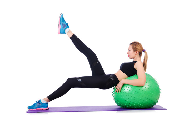 Young woman with ball exercising on white - Photo, Image