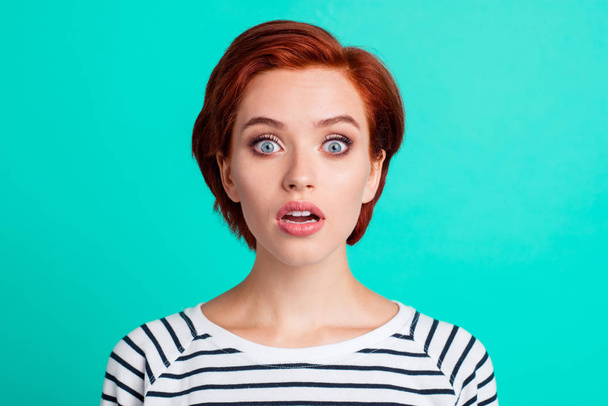 Close-up portrait of nice funny scared charming attractive red-haired lady in striped pullover opened mouth isolated over bright vivid shine green turquoise background - Foto, Bild