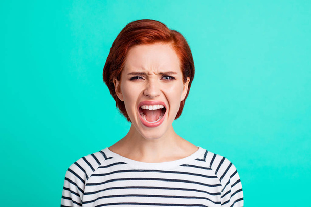 Close-up portrait of pretty attractive sad red-haired lady wearing striped pullover crying opened mouth isolated over bright vivid shine green turquoise background - Valokuva, kuva