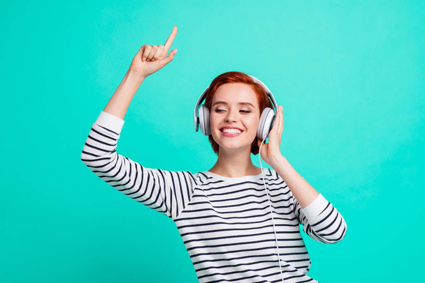 People good mood high spirits concept. Close up photo portrait of cheerful carefree careless glad nice beautiful millennial hearing familiar pop melody isolated on teal bright background - Foto, Imagem
