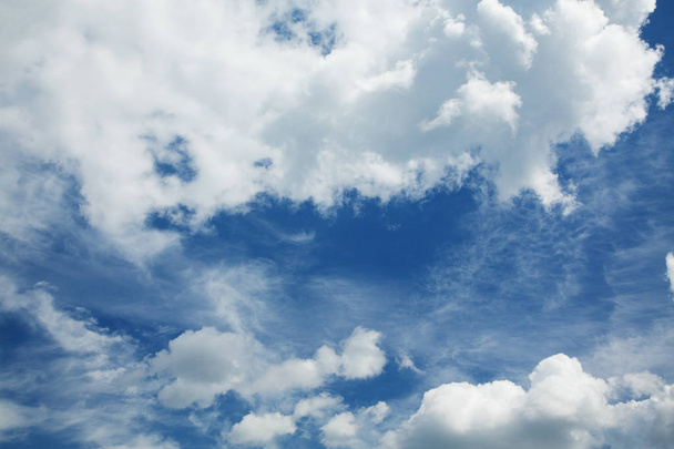 cumulus and cirrus clouds against a blue sky - Foto, Bild