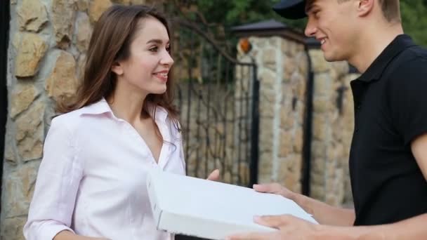 Food Delivery. Courier Giving Woman Box With Pizza Outdoors - Felvétel, videó