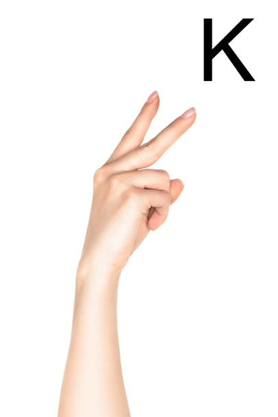 キリル文字、聾唖の言語の分離の白を示す女性の手のトリミング ビュー - 写真・画像