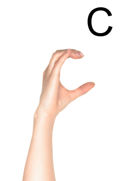 обрізаний вид жінки, що показує кирилицю, мова жестів, ізольовано на білому
 - Фото, зображення