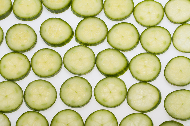 Freshly sliced cucumber isolated on white background - Zdjęcie, obraz