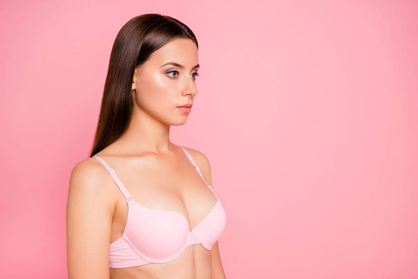 Half turned close up photo of gorgeous beautiful tenderness cleavage she her woman dressed in pale pink bra flawless isolated on rose background - Photo, Image