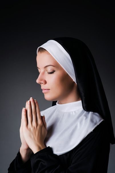 Young nun in religious concept - Фото, изображение