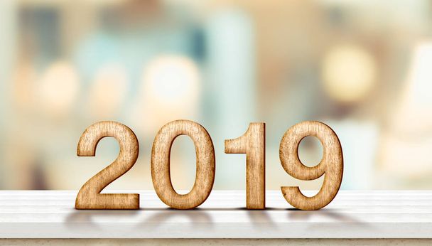 Happy new year 2019 on marble table with pale soft bokeh wall,banner for display or montage of product for holiday promotion and advertise for online content. - Foto, Imagem