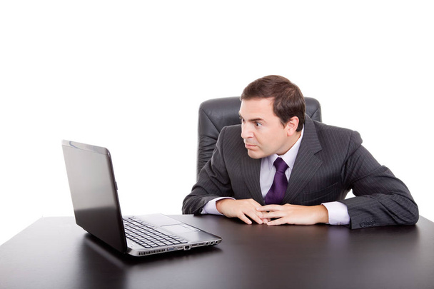 worried business man working with is laptop, isolated - 写真・画像