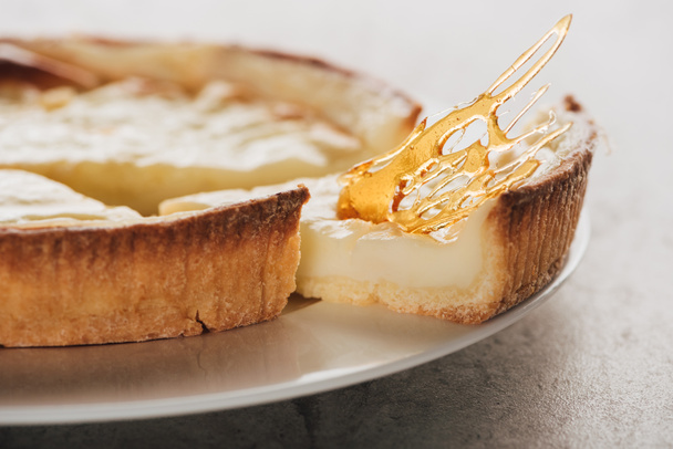 close-up view of delicious flan cake with caramel on white plate  - Zdjęcie, obraz