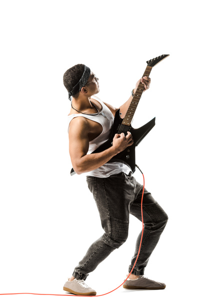 handsome young male rock musician playing on electric guitar isolated on white - Foto, Imagem