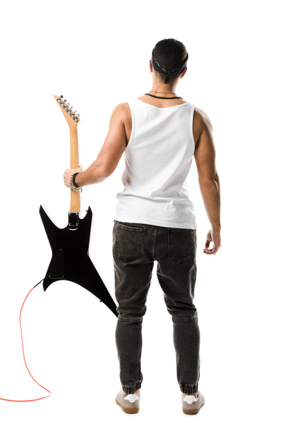 back view of male rock musician posing with black electric guitar isolated on white - Photo, Image