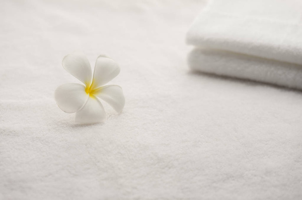 Frangipani flower and Towel on background,close up - Fotó, kép