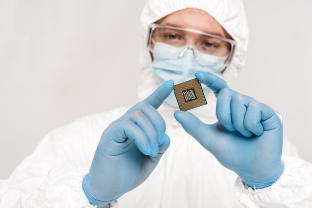 selective focus of microchip in hands of scientist wearing latex gloves and googles isolated on grey - Photo, Image