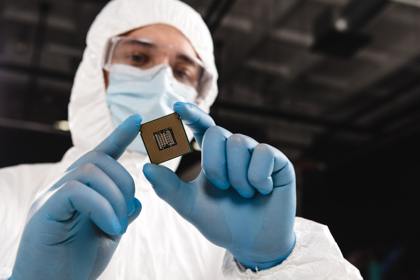 selective focus of microchip in hands of scientist wearing latex gloves  - Photo, Image