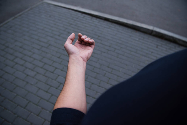 cropped view of male hand with bricks on background   - Fotografie, Obrázek