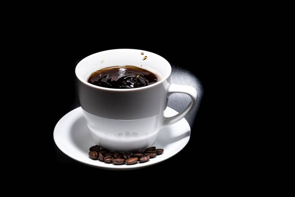 White cup and saucer with coffee on a black background 2018 - Foto, Imagen