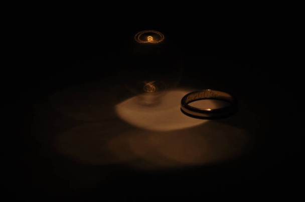 Gold wedding rings. Certificate and a symbol of marriage. Relationship. Love and trust. - Photo, Image