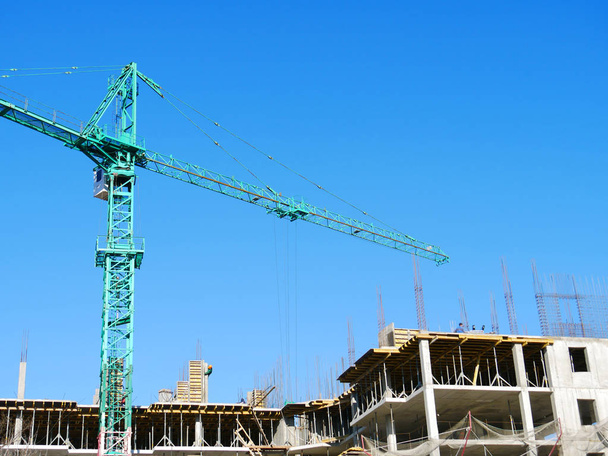 Crane and building under construction. Construction site. - Photo, Image