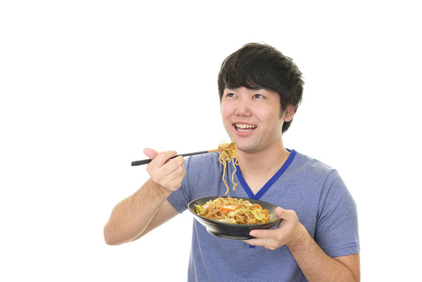 O homem que come comida
 - Foto, Imagem