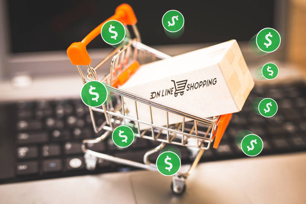Concept image about shopping and online sales. Shopping cart with generic logos, online commerce and its growth. - Photo, Image