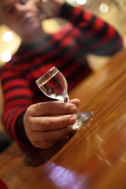 Man with vodka in bar - Foto, afbeelding