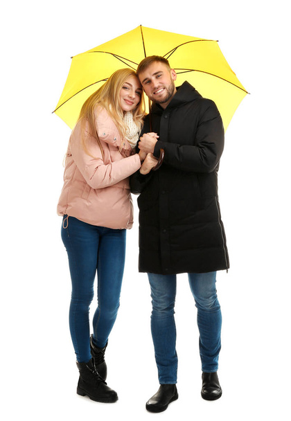 Full length portrait of beautiful couple with umbrella, isolated on white - Foto, immagini