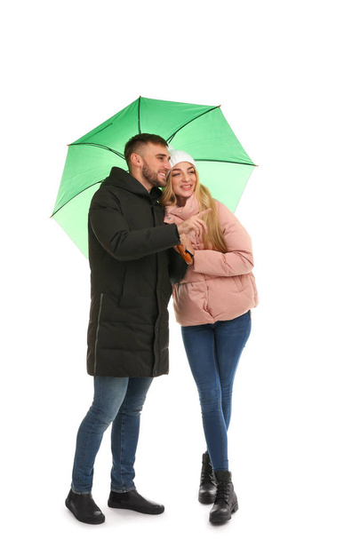 Full length portrait of beautiful couple with umbrella, isolated on white - Zdjęcie, obraz