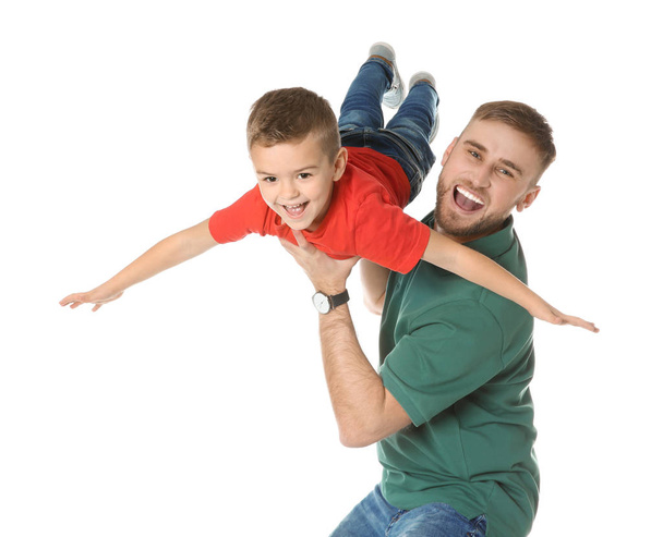 Father and son having fun on white background - Fotó, kép