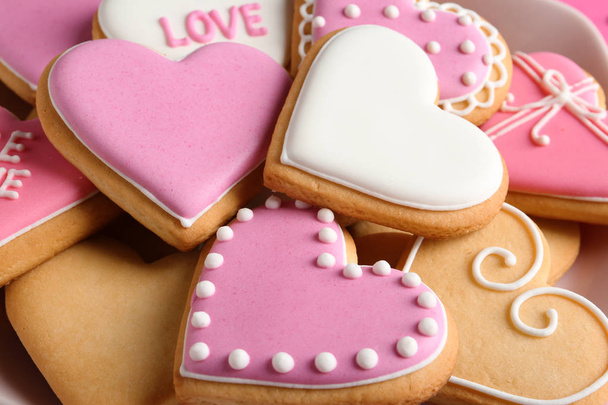 Decorated heart shaped cookies, closeup. Valentine's day treat - Zdjęcie, obraz