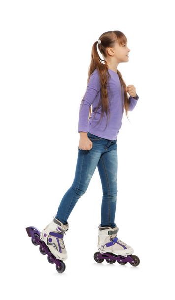 Little girl with inline roller skates on white background - Foto, afbeelding