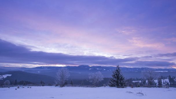 winter in mountains landscape, sunrise purple sky  - Φωτογραφία, εικόνα