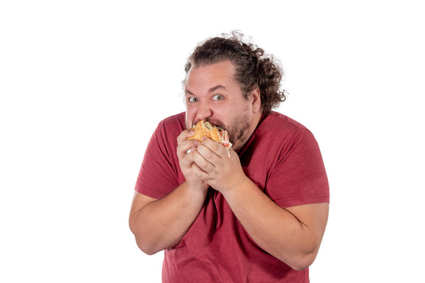 Funny fat man eating hamburger. Fast food, unhealty eat - Фото, зображення