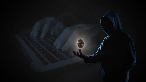 Bitcoin dorato galleggiante sopra la mano di hacker in buio su hacker hacking con sfondo computer portatile con spazio di copia. Concetto di finanza, imprese, commercio elettronico o criminalità informatica
 - Foto, immagini