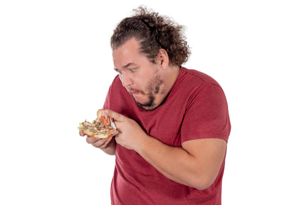 Funny fat man eating hamburger. Fast food, unhealty eat - Fotó, kép