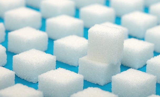 Cubes de sucre sucré blanc motif sans couture - fond bleu - Photo, image