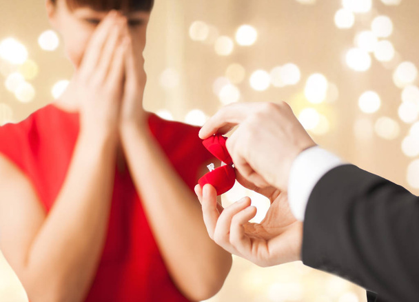 man giving diamond ring to woman on valentines day - Foto, Imagem