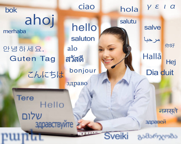 woman with laptop over words in foreign languages - 写真・画像