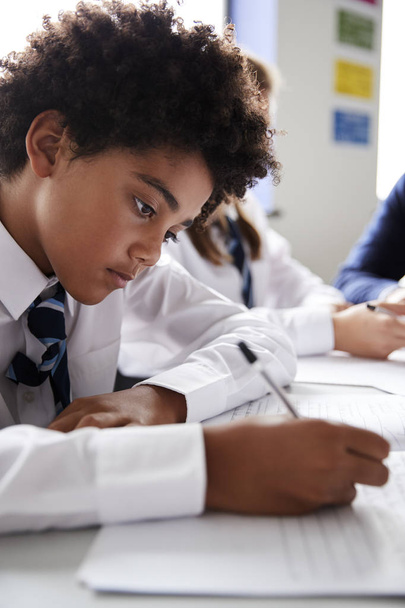 back to school, african american school boy writing at desk  - Фото, зображення