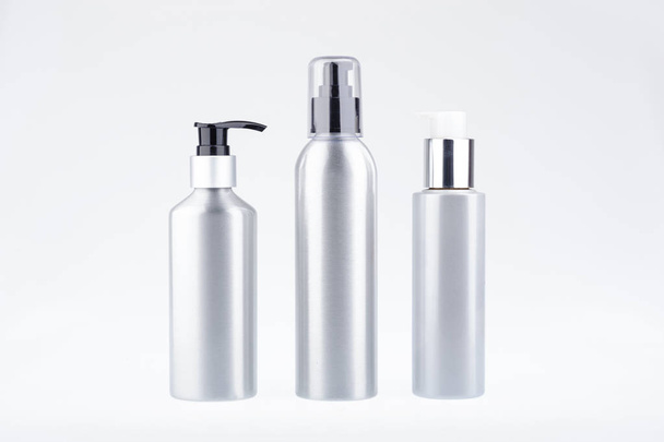 Aluminium cosmetic dispenser bottles. Cosmetic product dispenser bottle - Photo, Image
