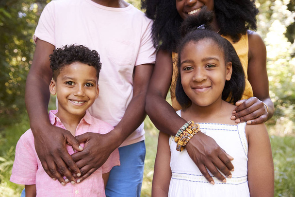 Mid section of black couple and their two children, portrait - Photo, Image