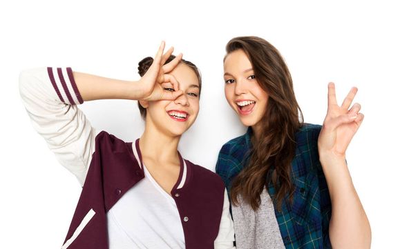 happy smiling teenage girls making gestures - Zdjęcie, obraz