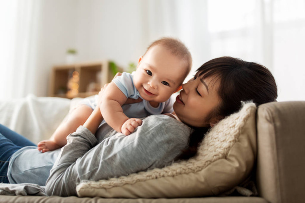 happy mother with little baby son at home - 写真・画像