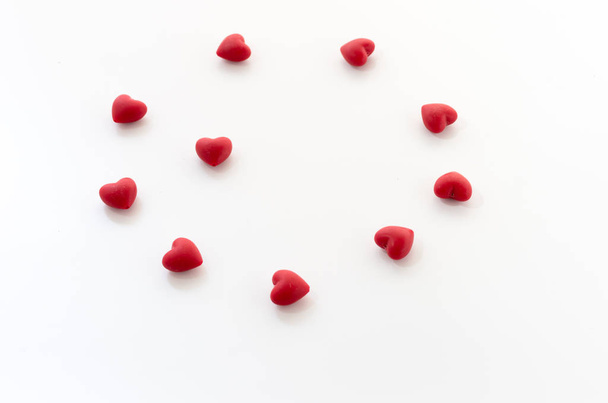 Many little hearts. Hearts on a white table. Front view. - Foto, imagen