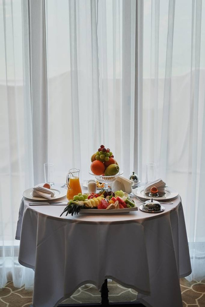 Delicious breakfast served for two at the hotel a white background. - 写真・画像
