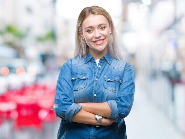 Young blonde woman over isolated background happy face smiling with crossed arms looking at the camera. Positive person. - Fotografie, Obrázek