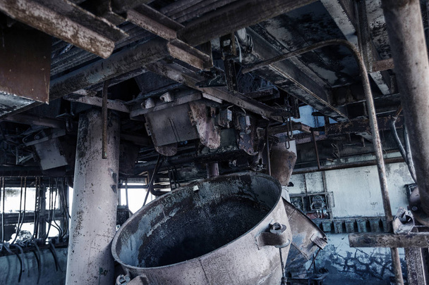 Old abandoned industrial building of cement plant Chernobyl. Ruins of an old factory. Rubbish, rusty metal is broken equipment of cement plant. Element for apocalyptic design, retro, stalker - Photo, Image
