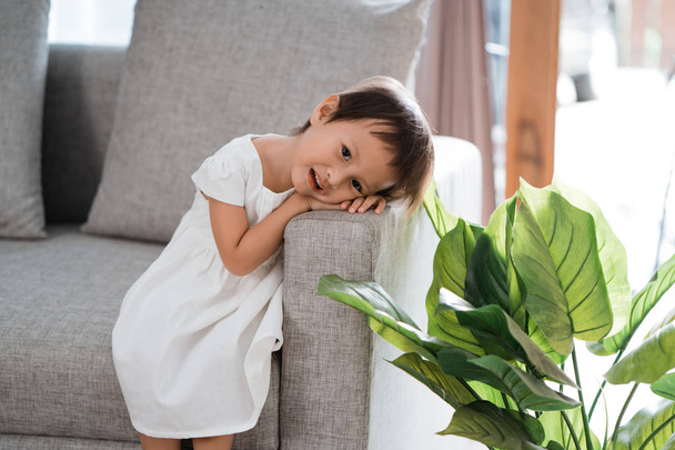 portrait of little girl sitting alone and lay his head down on a - Photo, image
