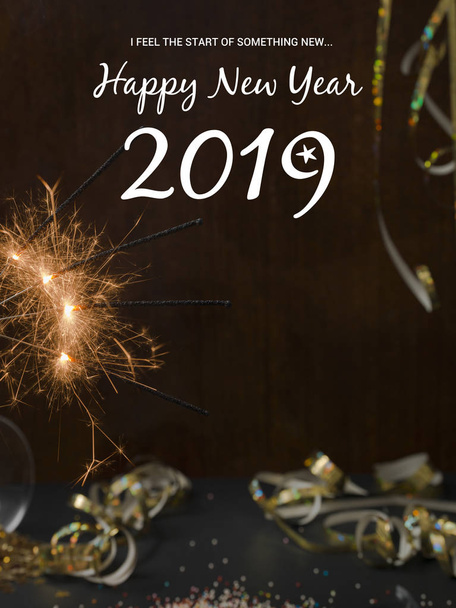 new year background with burning sparklers and Christmas items on background   - Valokuva, kuva