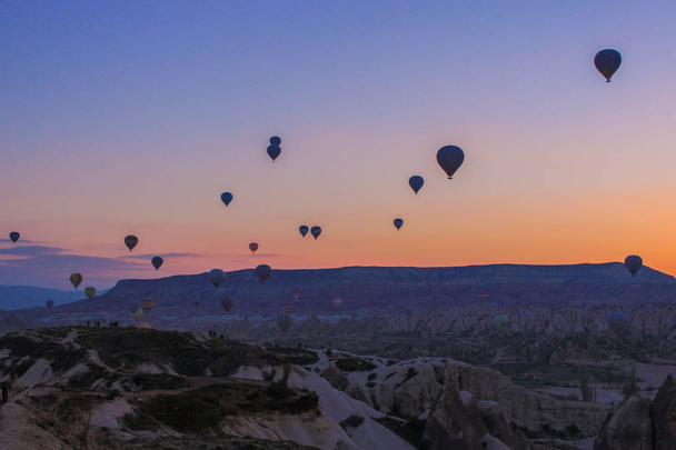 Turkey. Cappadocia. Morning. Sunrise. Caves. Balloons - Фото, изображение